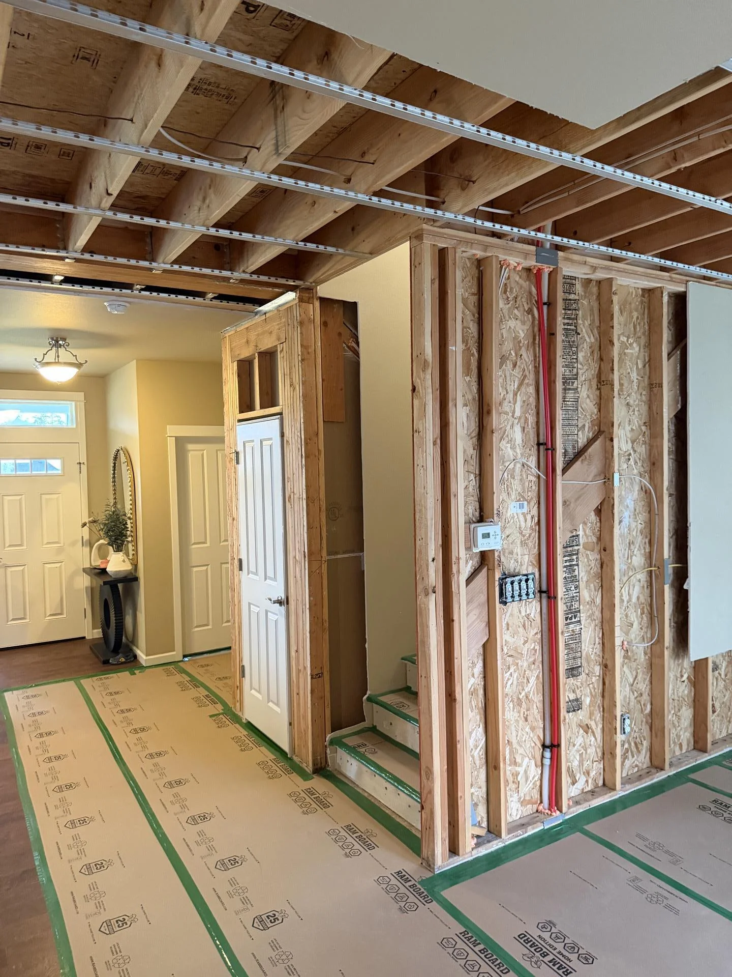 Failed toilet backed up into a two-story loss. Final walk-through, prepped for reconstruction.